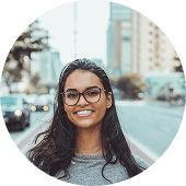 Smiling woman with glasses outdoors