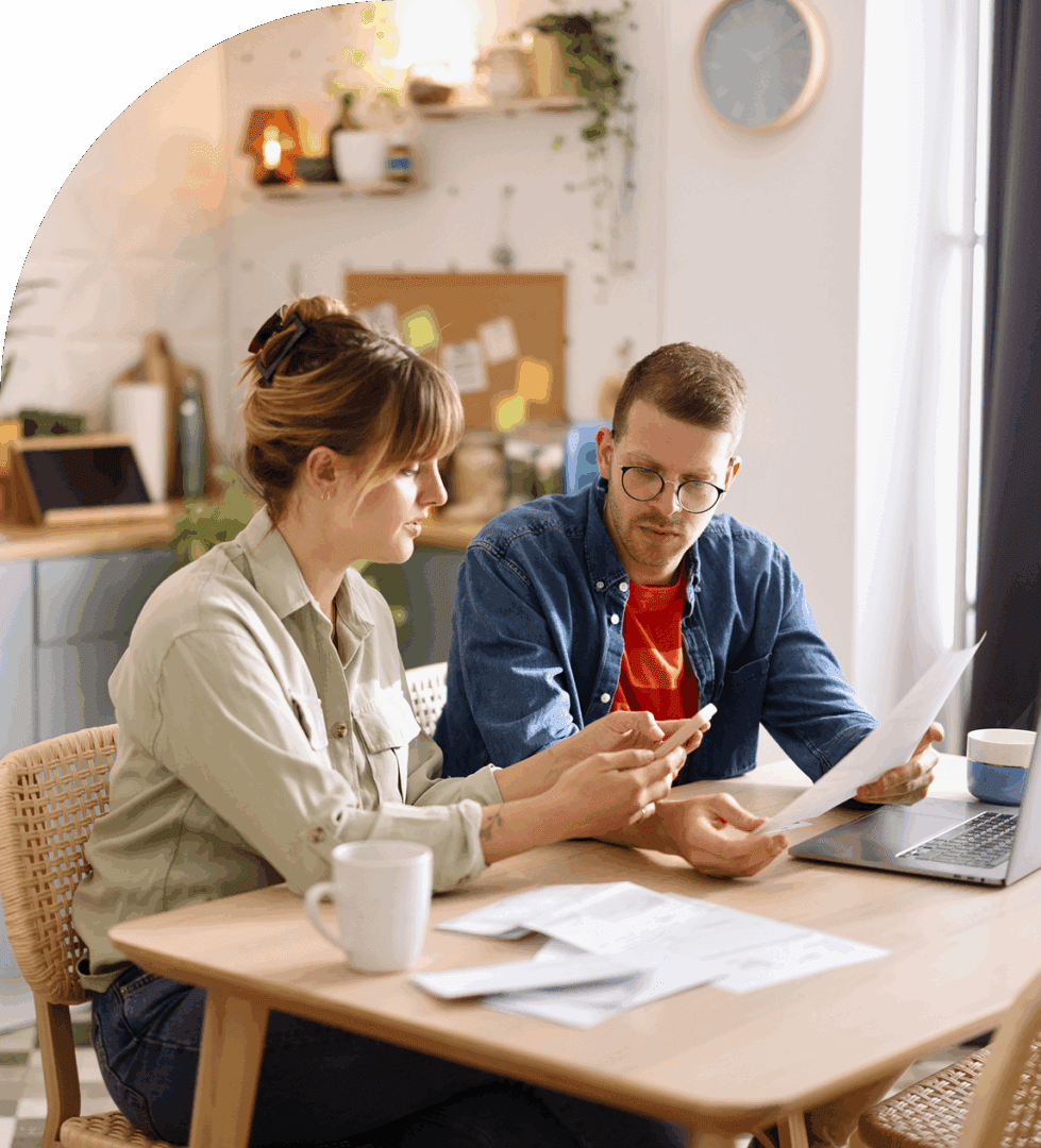 Couple reviewing documents at home